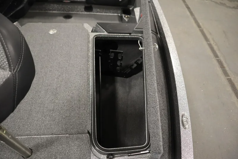 Slide: The Image of 2023 Ranger Z519 boat storage compartment with open lid, showcasing interior space. - 19