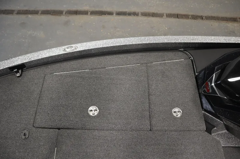 Slide: The Image of 2023 Ranger Z519 boat deck with carpeted storage compartments. - 20