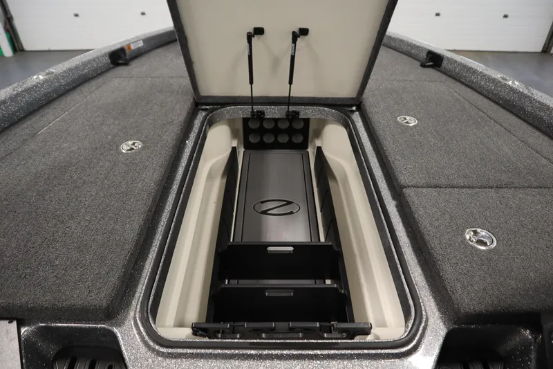 Slide: The Image of 2023 Ranger Z519 boat storage compartment with open lid, showcasing organized interior space. - 23