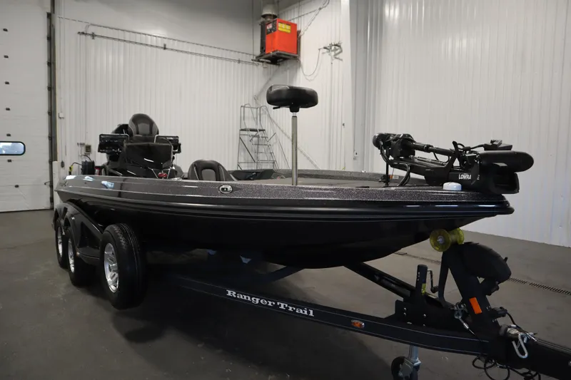 Slide: The Image of 2023 Ranger Z519 boat in a garage, featuring a sleek design and advanced equipment. - 3