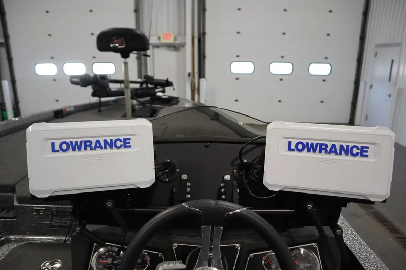 Slide: The Image of 2023 Ranger Z519 boat dashboard with dual Lowrance HDS displays in a garage setting. - 32