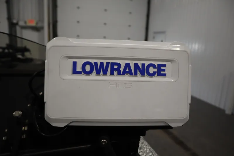 Slide: The Image of Lowrance HDS unit on 2023 Ranger Z519 boat in a garage setting. - 33