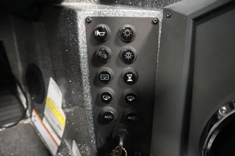 Slide: The Image of Control panel of 2023 Ranger Z519 boat with various function buttons. - 37