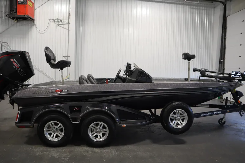 Slide: The Image of 2023 Ranger Z519 boat in a garage, side view with trailer. - 4