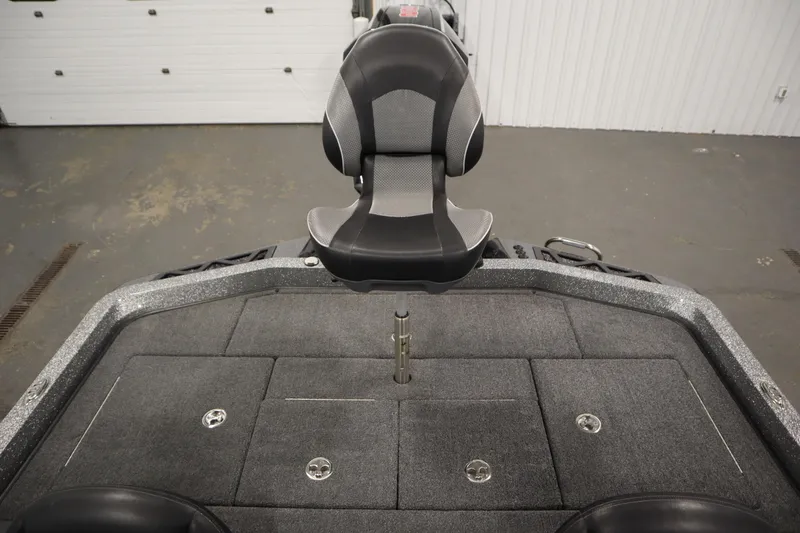 Slide: The Image of 2023 Ranger Z519 boat interior with a central seat and carpeted deck. - 44