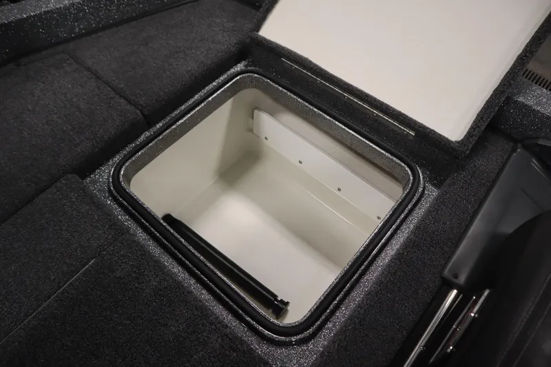 Slide: The Image of Open storage compartment in 2023 Ranger Z519 boat, featuring a spacious interior. - 47