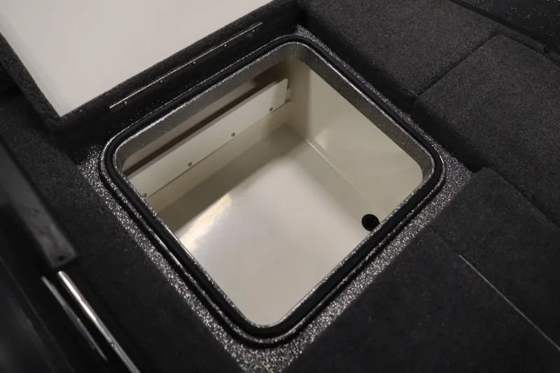 Slide: The Image of 2023 Ranger Z519 boat storage compartment with open lid, showcasing interior space. - 49
