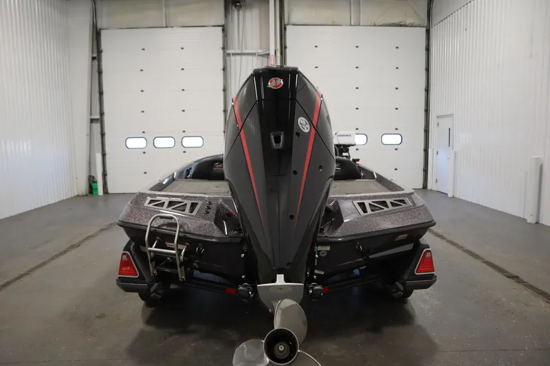 Slide: The Image of 2023 Ranger Z519 boat in a garage, rear view with motor and trailer. - 6