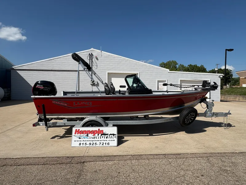 The Image of 2025 Lund 1875 Alaskan Sport boat on trailer, displayed outdoors at Hennepin Marine. - 0