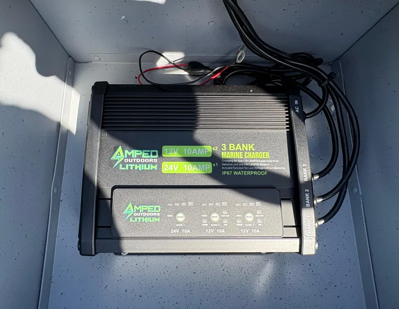 Slide: The Image of Amped Outdoors Lithium 3-bank marine charger in 2025 Lund 1875 Alaskan Sport boat. - 11