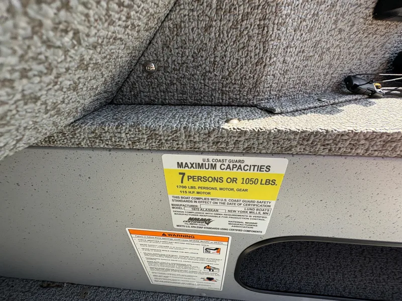 Slide: The Image of 2025 Lund 1875 Alaskan Sport boat capacity label, maximum 7 persons or 1050 lbs. - 31