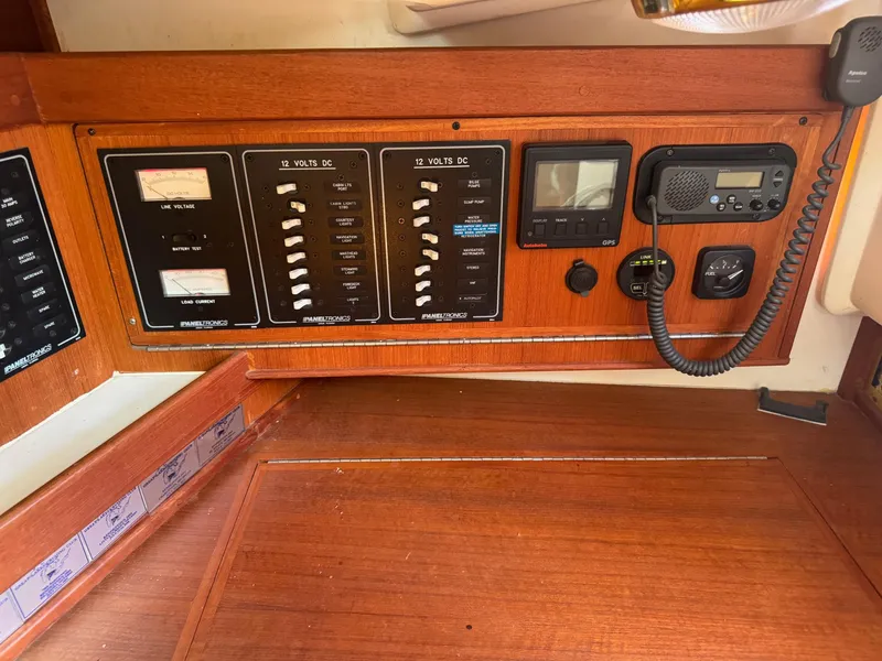 Slide: The Image of Control panel of a 1997 Tartan 3500 sailboat with navigation and communication equipment. - 16