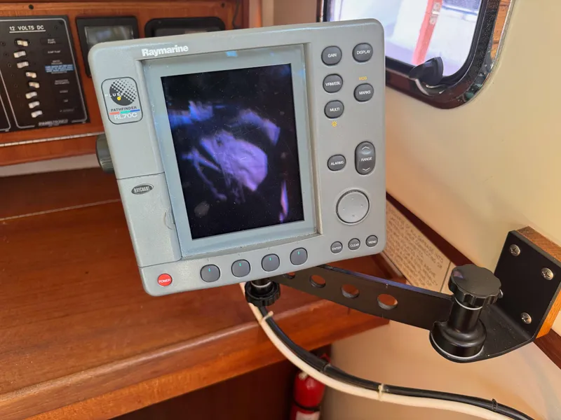 Slide: The Image of Raymarine Pathfinder RL70C marine display on Tartan 3500, 1997 model, mounted on a wooden panel. - 18
