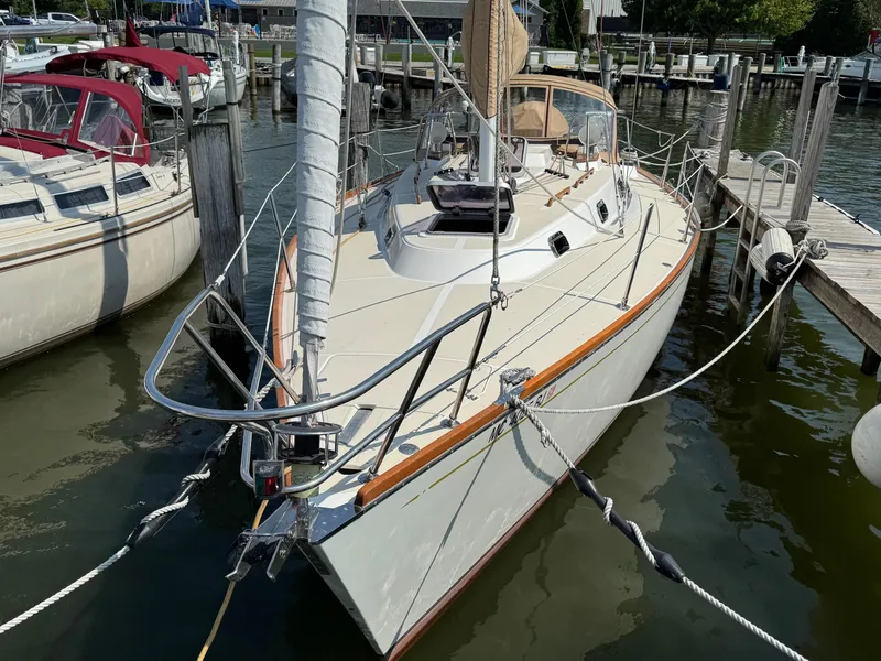 Slide: The Image of Sailboat docked at marina, 1997 Tartan 3500 model, surrounded by other boats. - 2