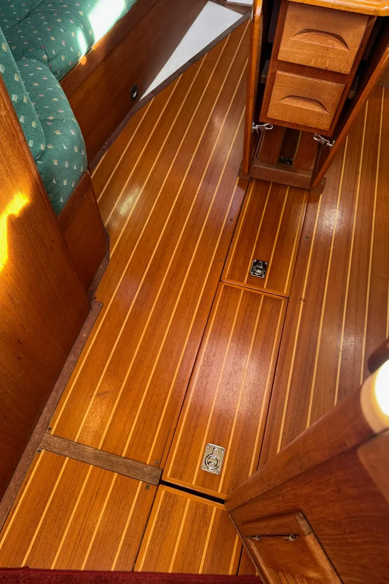 Slide: The Image of Wooden interior flooring of a 1997 Tartan 3500 sailboat cabin. - 25
