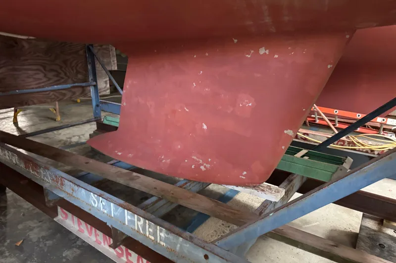 Slide: The Image of Red keel of a 1997 Tartan 3500 sailboat on a metal stand. - 28