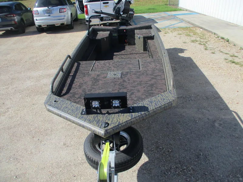 Slide: The Image of 2025 Gator Tail 1750 Savage boat on trailer, parked in a lot. - 3