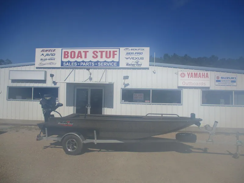 Slide: The Image of 2025 Gator Tail 1750 Savage boat outside dealership with sales, parts, and service signs. - 5