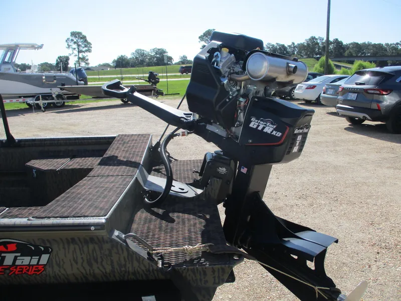 Slide: The Image of 2025 Gator Tail 1750 Savage boat with powerful outboard motor in a sunny outdoor setting. - 6