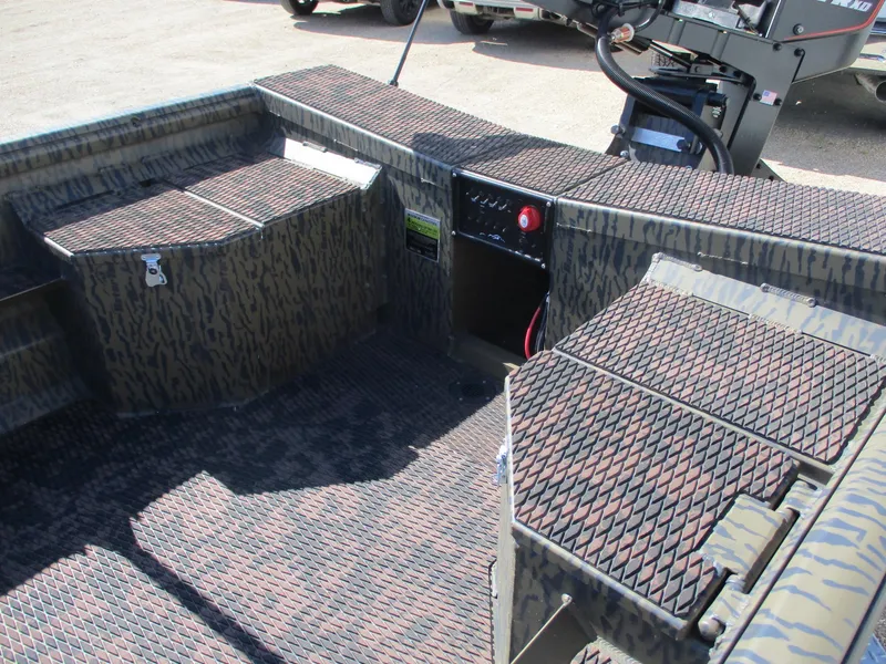 Slide: The Image of 2025 Gator Tail 1750 Savage boat interior with camo design and storage compartments. - 8