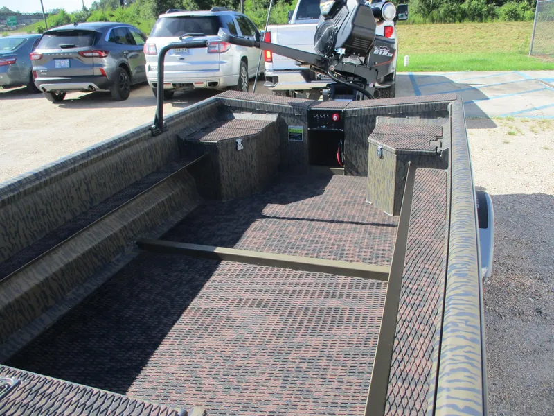 Slide: The Image of 2025 Gator Tail 1750 Savage boat interior with camouflage design in parking lot. - 9