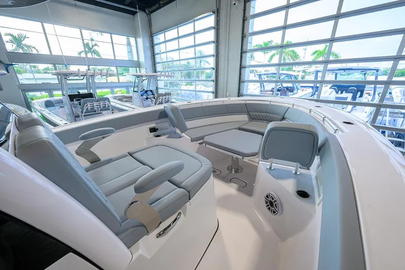 Slide: The Image of 2026 Sportsman Heritage 321 Center Console interior with seating and table in showroom. - 10