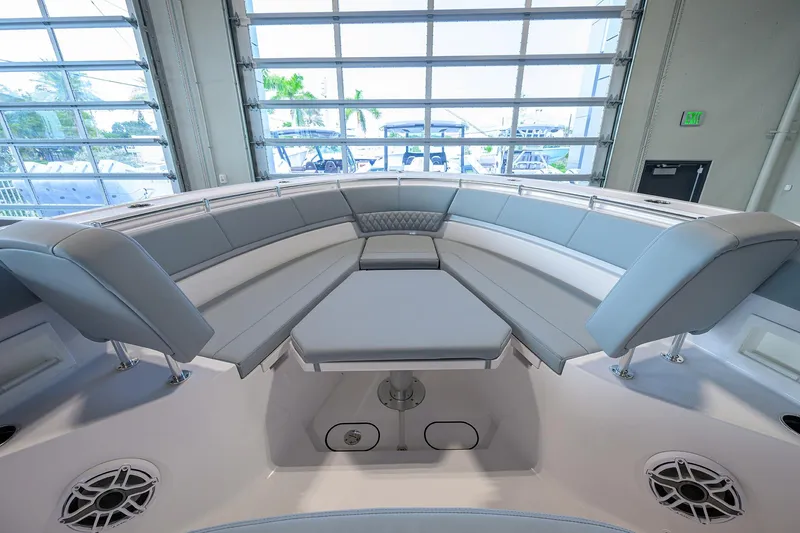 Slide: The Image of 2026 Sportsman Heritage 321 Center Console boat interior with spacious seating and modern design. - 11
