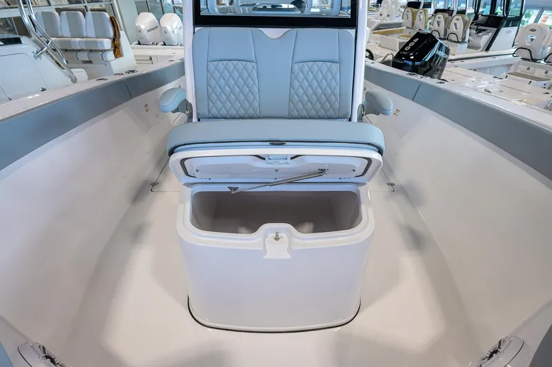 Slide: The Image of 2026 Sportsman Heritage 321 Center Console boat interior with open storage compartment. - 12