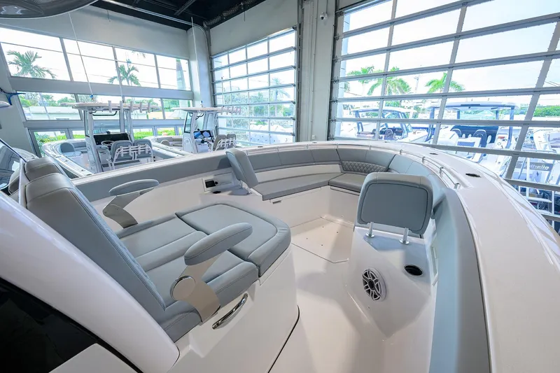 Slide: The Image of 2026 Sportsman Heritage 321 Center Console boat interior with seating and modern design. - 13