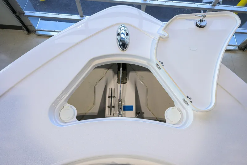 Slide: The Image of 2026 Sportsman Heritage 321 Center Console anchor locker with open hatch. - 14