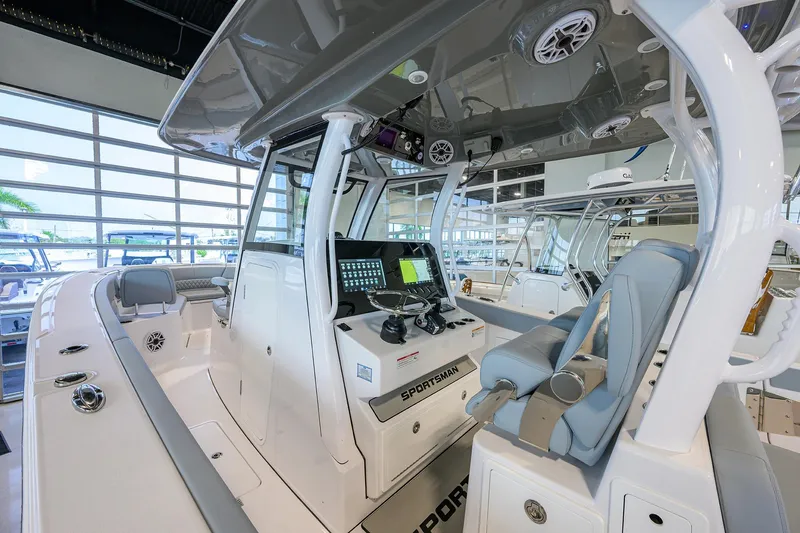 Slide: The Image of 2026 Sportsman Heritage 321 Center Console boat interior with advanced navigation system. - 16