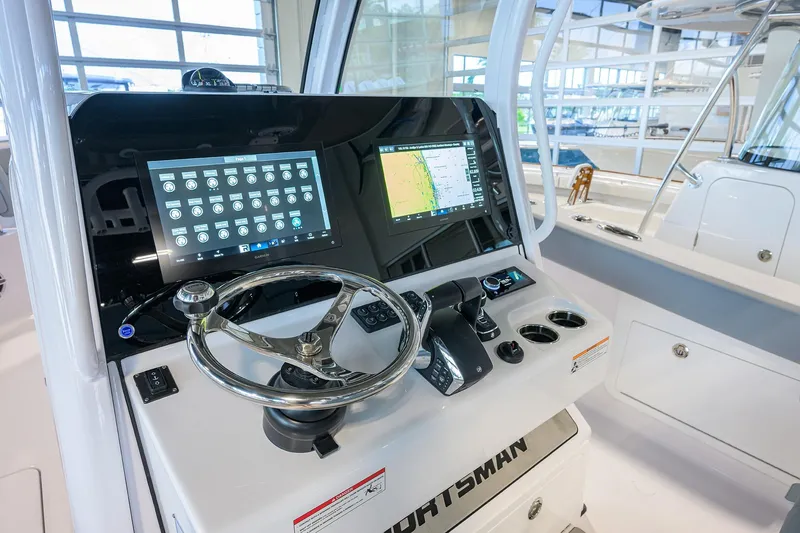 Slide: The Image of 2026 Sportsman Heritage 321 Center Console dashboard with advanced navigation displays. - 20