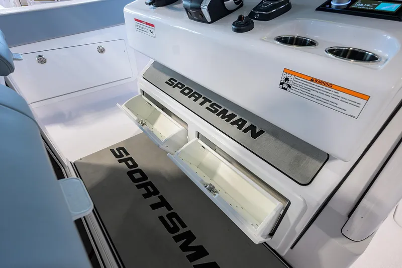 Slide: The Image of 2026 Sportsman Heritage 321 Center Console interior with storage compartments and control panel. - 21