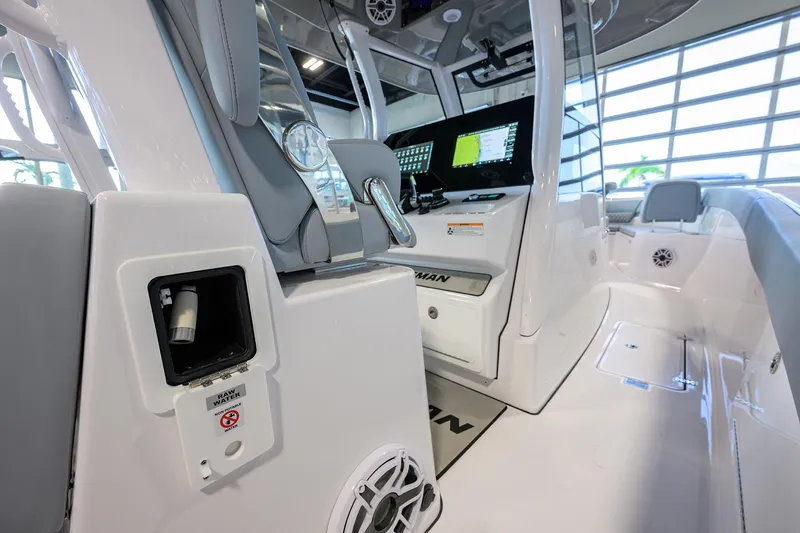 Slide: The Image of 2026 Sportsman Heritage 321 Center Console interior with advanced navigation system and sleek design. - 23