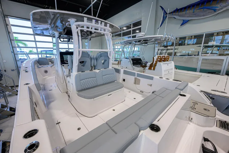Slide: The Image of 2026 Sportsman Heritage 321 Center Console boat interior with sleek seating and modern design. - 25