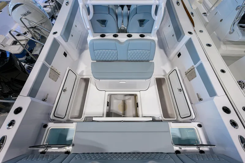 Slide: The Image of 2026 Sportsman Heritage 321 Center Console boat interior with seating and storage compartments. - 28