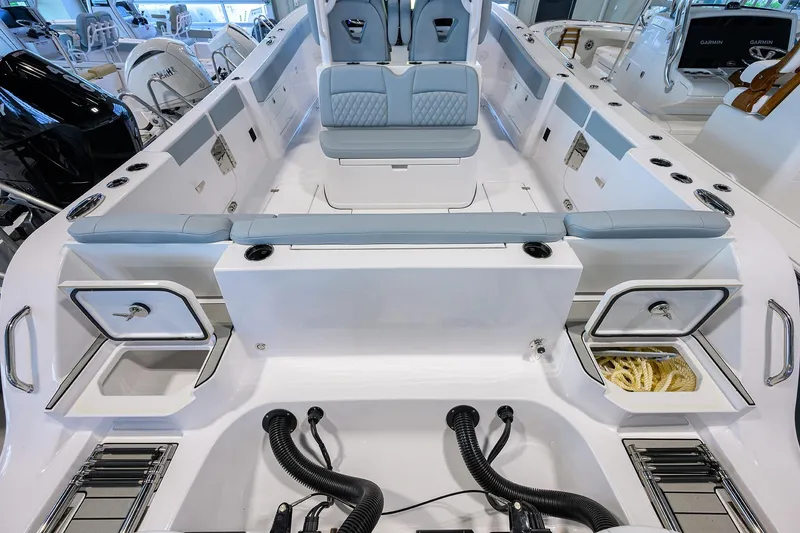 Slide: The Image of 2026 Sportsman Heritage 321 Center Console boat interior with seating and storage compartments. - 29