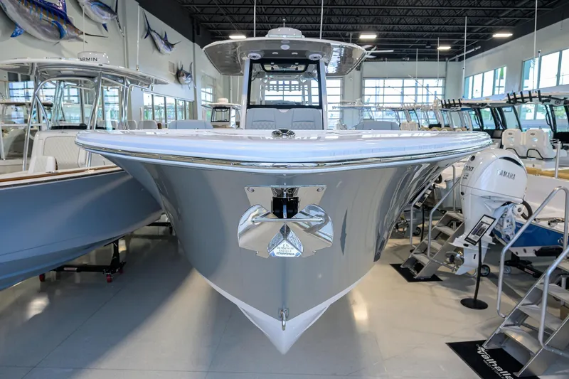 Slide: The Image of 2026 Sportsman Heritage 321 Center Console boat displayed in showroom. - 3