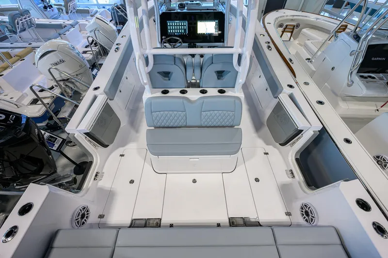 Slide: The Image of 2026 Sportsman Heritage 321 Center Console boat interior with modern seating and control panel. - 33