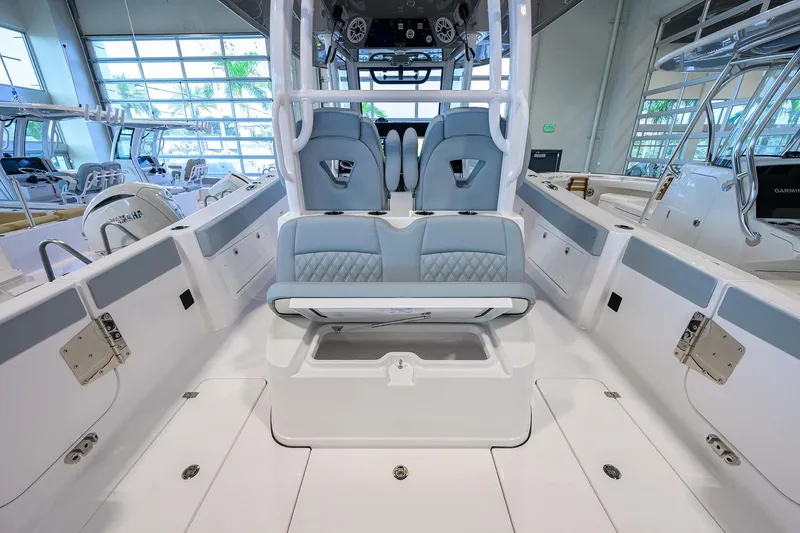 Slide: The Image of 2026 Sportsman Heritage 321 Center Console boat interior with modern seating and controls. - 34