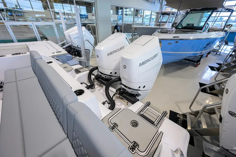 Slide: The Image of 2026 Sportsman Heritage 321 Center Console with Mercury engines in showroom. - 35