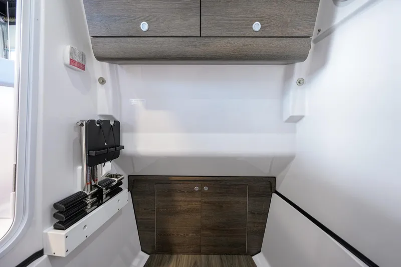 Slide: The Image of 2026 Sportsman Heritage 321 Center Console interior with wood accents and storage compartments. - 37