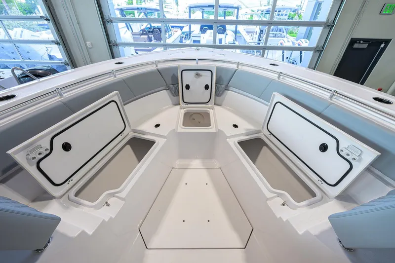 Slide: The Image of 2026 Sportsman Heritage 321 Center Console boat interior with open storage compartments. - 8