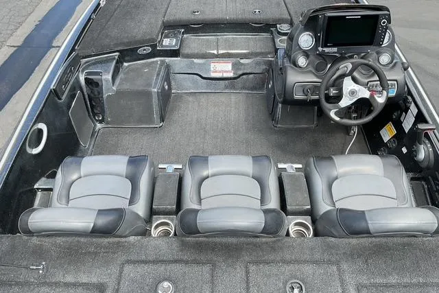 Slide: The Image of Interior of a 2015 Nitro Z-9 boat with three seats and a steering console. - 11