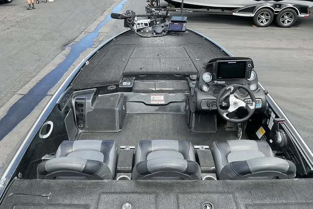 Slide: The Image of 2015 Nitro Z-9 boat interior with steering wheel and seating arrangement. - 12