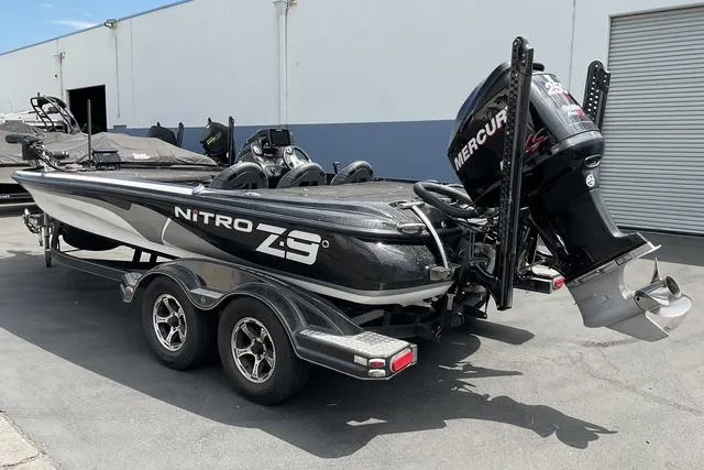 Slide: The Image of 2015 Nitro Z-9 boat with Mercury engine on trailer, parked outdoors. - 6