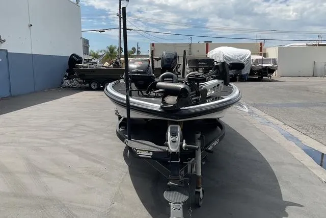 Slide: The Image of 2015 Nitro Z-9 boat parked outdoors in a marina setting. - 7