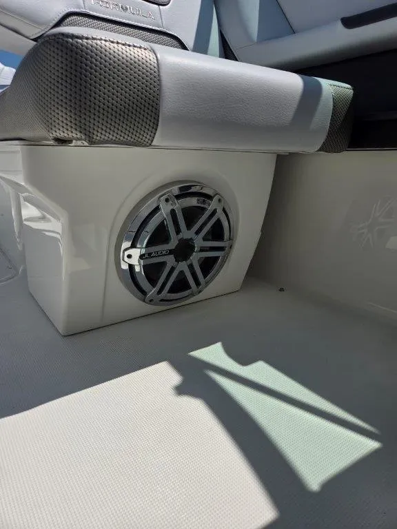 Slide: The Image of 2016 Formula 290 Bowrider interior with JL Audio speaker and cushioned seating. - 10