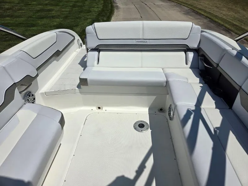 Slide: The Image of 2016 Formula 290 Bowrider interior with white seating and spacious layout. - 11