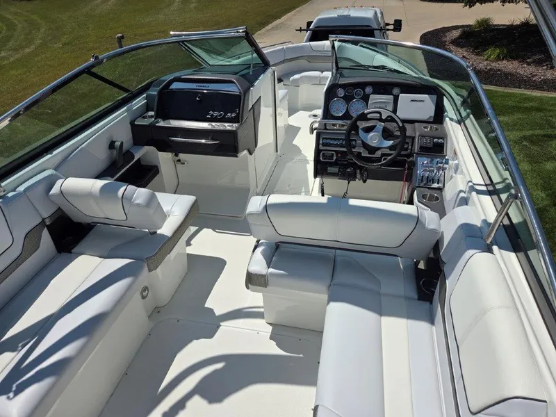 Slide: The Image of 2016 Formula 290 Bowrider interior with white seating and modern dashboard. - 21